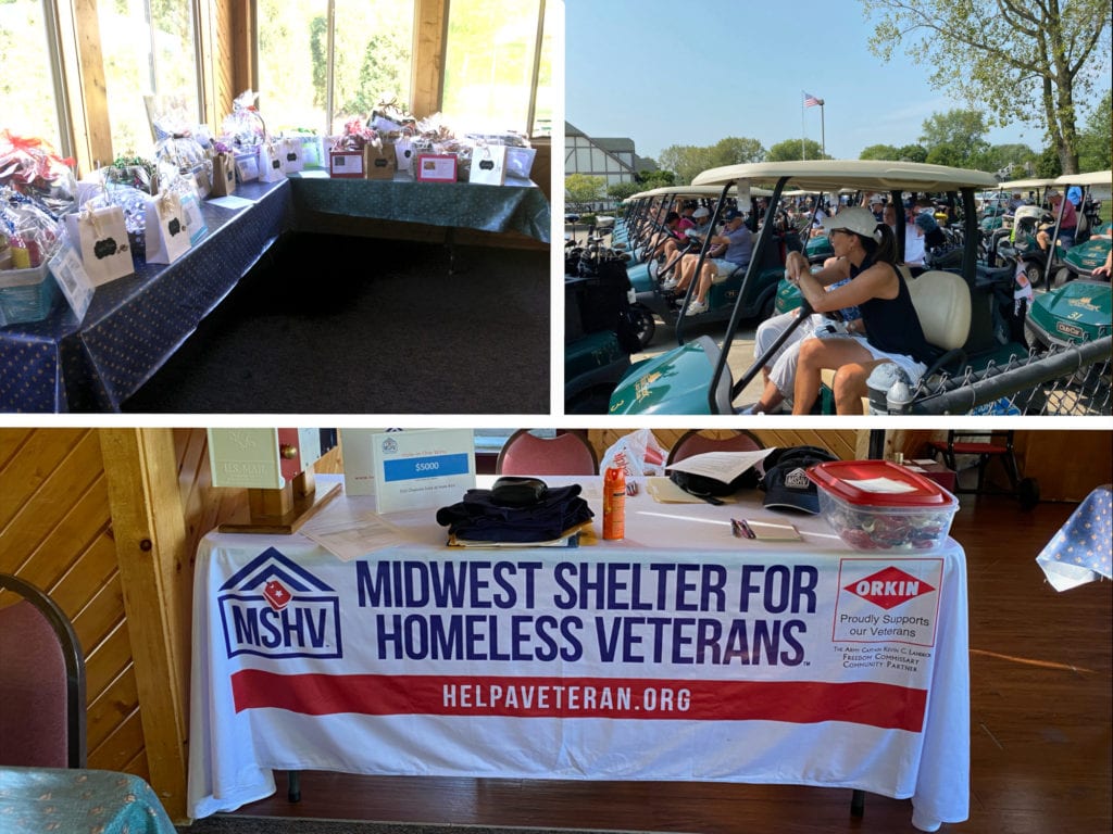 A table full of gifts, people sitting in golf carts, and a table with a banner for Midwest Shelter for Homeless Veterans